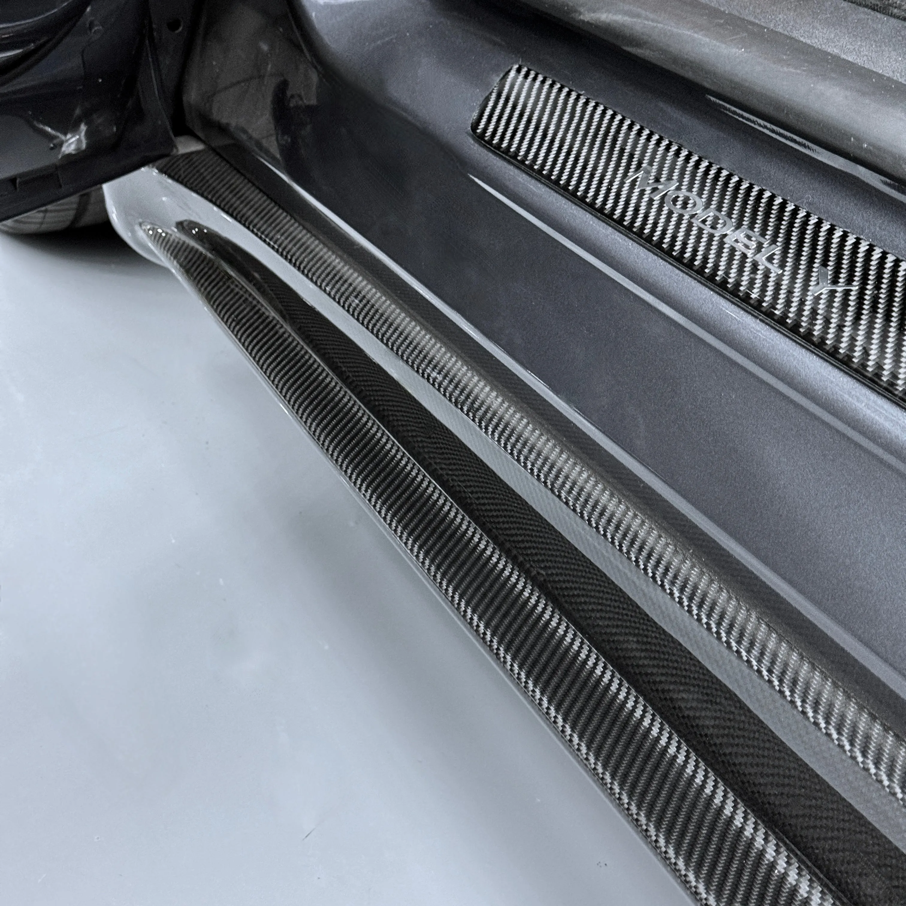 Model Y Colossal Side Skirt Overlays - Real Dry Molded Carbon Fiber